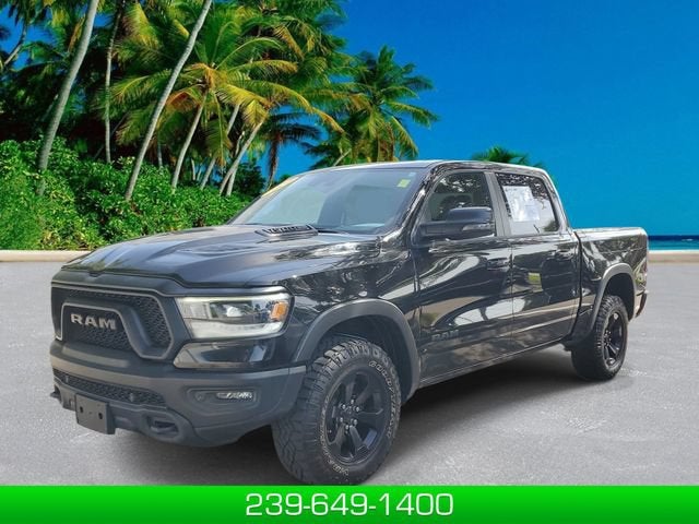 2024 RAM 1500 Rebel Crew Cab 4x4 5'7" Box in Black — front three-quarter view
