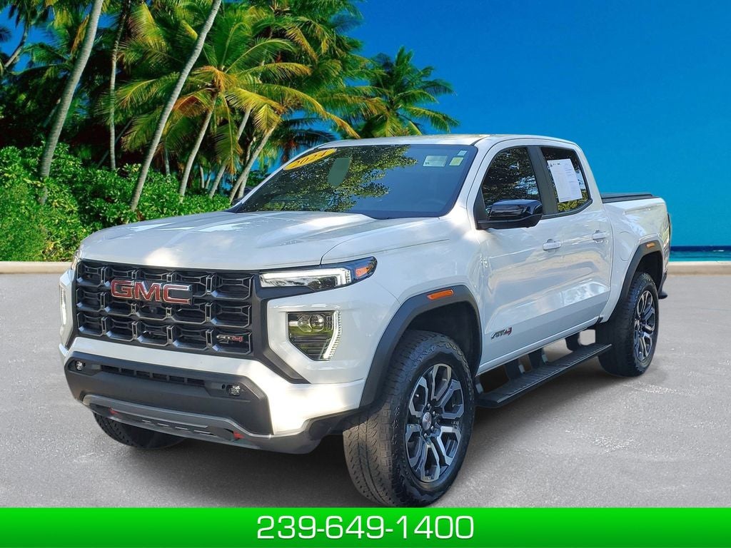2024 GMC Canyon AT4 in Summit White — front three-quarter view